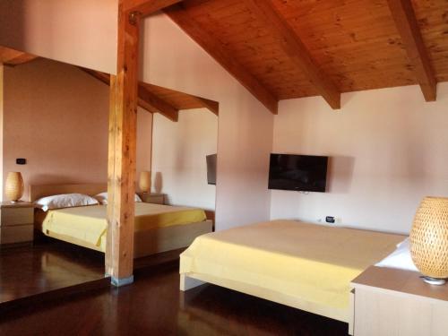 Tempat tidur dalam kamar di Oasi di Frattamaggiore