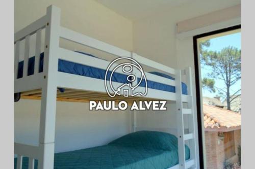 a bedroom with a bunk bed with the name paulula avelez at BAHIA SAN FRANCISCO, casa Albatros a 80 metros del mar, Uruguay in Piriápolis