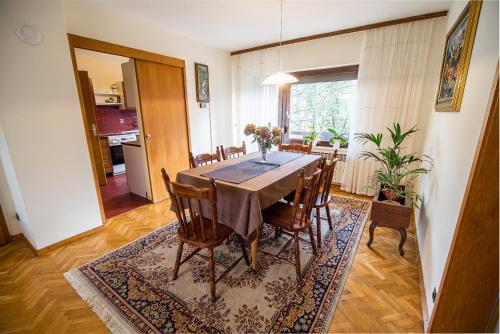 a dining room with a table and chairs at Holiday Home by the River Krka in Krška Vas