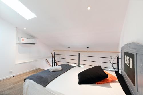 Säng eller sängar i ett rum på Atelier Duplex