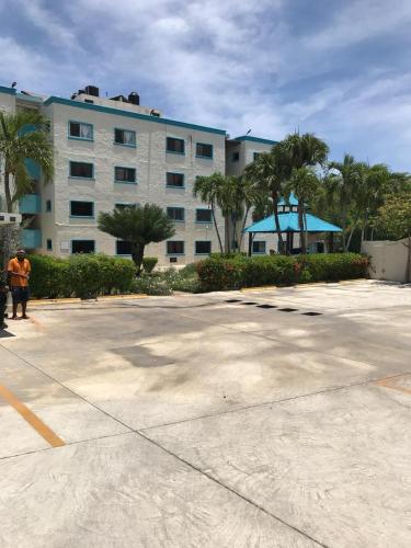 a large parking lot in front of a building at La Gaviota B1 in Juan Dolio