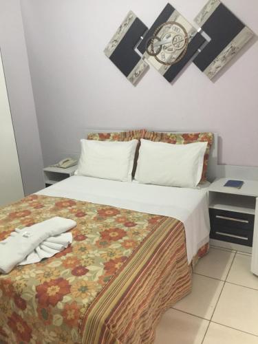 
A bed or beds in a room at Hotel Estrela Dalva
