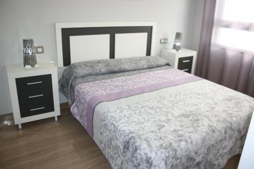 A bed or beds in a room at Camalavi