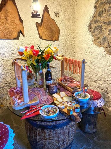 a table with food on top of a barrel at Il Roccolino in Valsecca