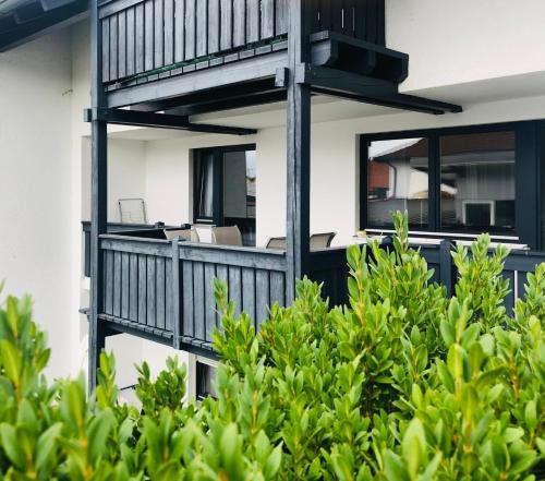 an image of a house with a balcony at Ferienwohnungen Hecker in Bad Gögging