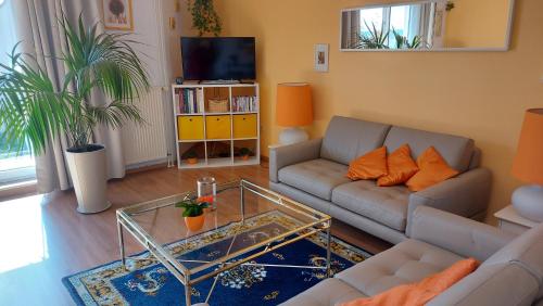 a living room with a couch and a coffee table at Von-Thünen in Schwerin