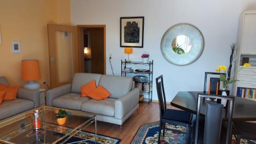 a living room with a couch and a table at Von-Thünen in Schwerin