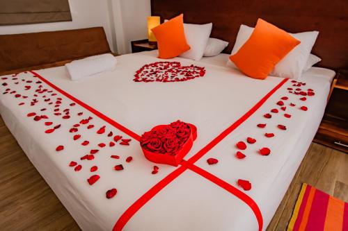 a bed with red roses and a heart on it at Tranquil Wild in Tanamalwila