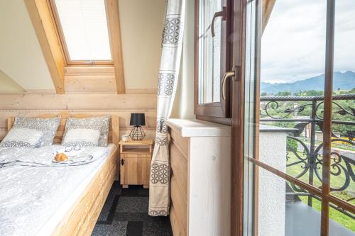 Postel nebo postele na pokoji v ubytování Osada LUX-HOUSE & SAUNA