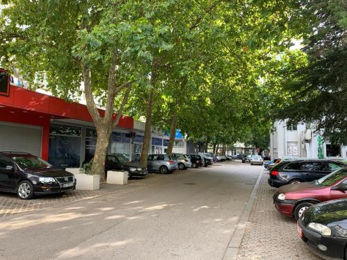 a street with cars parked in front of a store at Sea&Center Lux in Bar