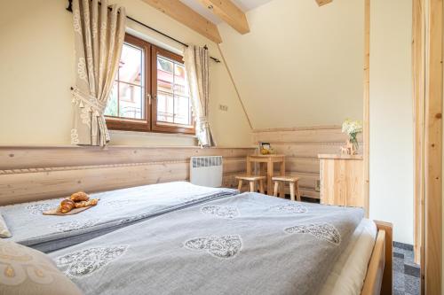 Postel nebo postele na pokoji v ubytování Osada LUX-HOUSE & SAUNA