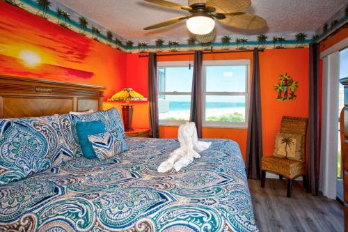 a bedroom with a bed with a stuffed animal on it at 505 - Gulf Strand in St Pete Beach