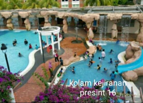 a group of people in a water park at Mintsuite homestay in Putrajaya