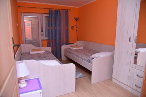 Postel nebo postele na pokoji v ubytování Apartman Stevanovic
