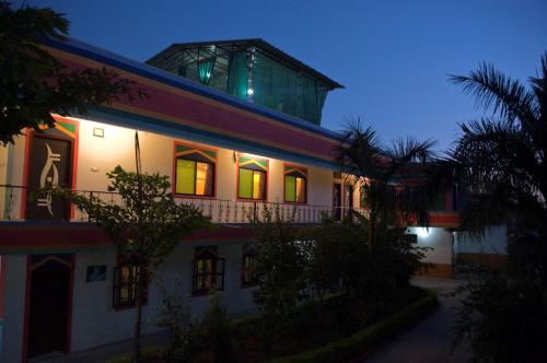 a building with a glass dome on top of it at Hotel Harmony in Khajurāho