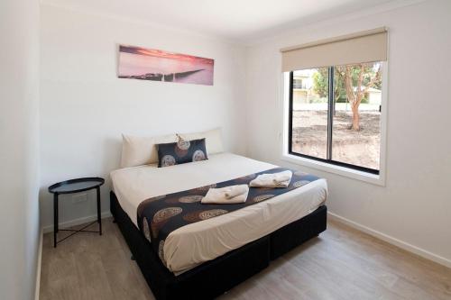 
a bedroom with a bed and a window at BIG4 Breeze Holiday Parks - Port Hughes in Port Hughes
