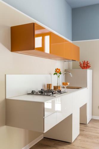 a kitchen with white countertops and a staircase at San Leonardo Suites in Verona