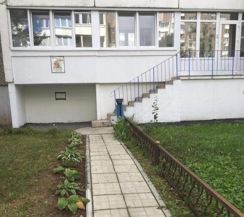 a house with a walkway in front of it at Hostel CUBA in Minsk