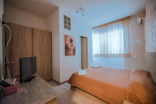 Postel nebo postele na pokoji v ubytování Hotel Sabatino