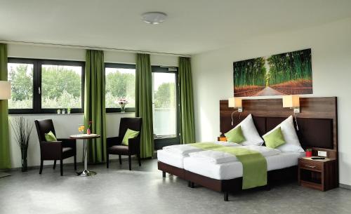 Postel nebo postele na pokoji v ubytování Motel am Fürfelder Schloss