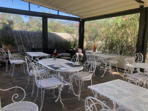 a group of tables and chairs on a patio at L'Acqua Viva in Calacuccia