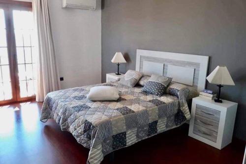 a bedroom with a bed with pillows on it at APPARTEMENT PENISCOLA Espagne in Peniscola