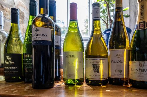 a group of wine bottles sitting on a table at Ty Mawr Country Hotel & Restaurant in Carmarthen