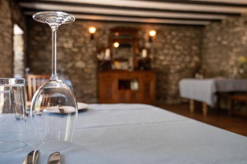 a wine glass sitting on top of a table at Ty Mawr Country Hotel & Restaurant in Carmarthen