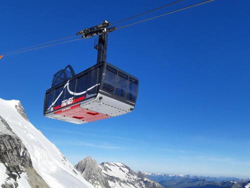 a ski lift over a snow covered mountain at Chalet Le Grand Cap in Tignes