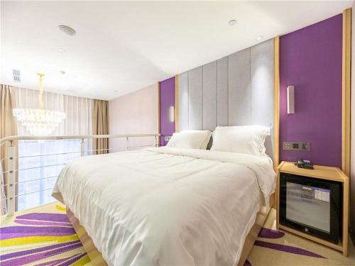Кровать или кровати в номере Lavande Hotel(Nanchang Qingshan Road Subway Station Branch)