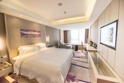 Ένα ή περισσότερα κρεβάτια σε δωμάτιο στο Lavande Hotel Shenzhen Baoan Haiya Binfencheng