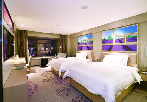 Ένα ή περισσότερα κρεβάτια σε δωμάτιο στο Lavande Hotel Wuhan Wuchang Railway Station Plaza Branch