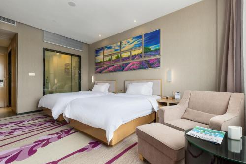 Ένα ή περισσότερα κρεβάτια σε δωμάτιο στο Lavande Hotel Guangzhou Sunac Cultural Tourism City Branch