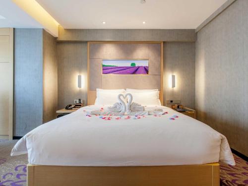 Ένα ή περισσότερα κρεβάτια σε δωμάτιο στο Lavande Hotel Wuhan Wuchang Railway Station Plaza Branch