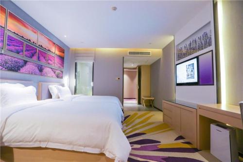 Posteľ alebo postele v izbe v ubytovaní Lavande Hotel Shijiazhuang Zhonghua North Street Zhongchu Plaza Branch