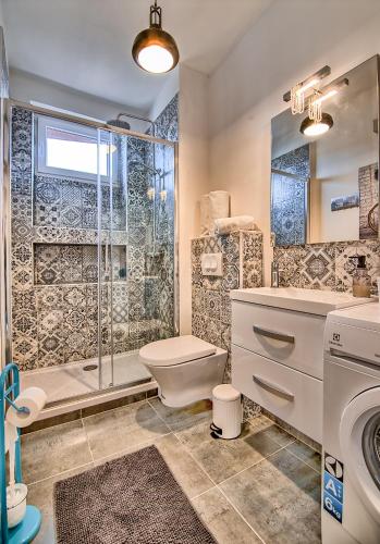 a bathroom with a toilet sink and a shower at Best view Pula in Pula