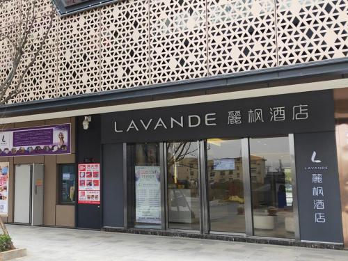 a store front of a building with a sign on it at Lavande Hotel (Nanchang West Railway Station Square Branch) in Nanchang