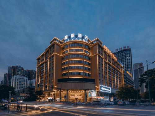 a tall building with a street in front of it at Lavande Hotel Changsha Xingsha Center in Xingsha