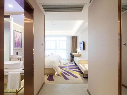 Postel nebo postele na pokoji v ubytování Lavande Hotel (Yingtan Longhushan Avenue Branch)