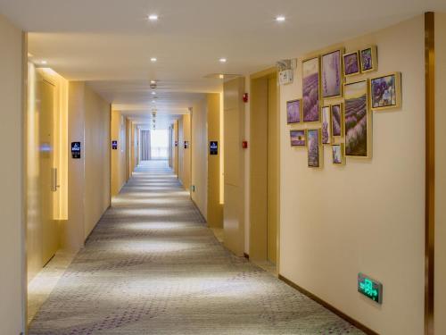 a corridor of a hospital hallway with yellow walls at Lavande Hotel Yangchun Donghu in Yangjiang
