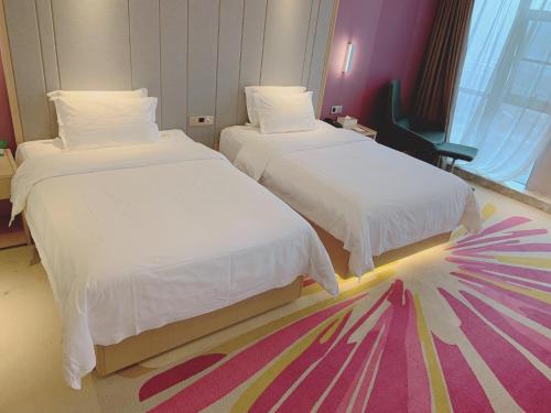 Katil atau katil-katil dalam bilik di Lavande Hotel (Fuzhou Wanda Branch)