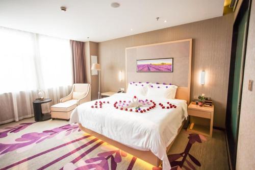Un ou plusieurs lits dans un hébergement de l'établissement Lavande Hotel Xuzhou East High-speed Rail Station Jinshanqiao Development Zone Branch