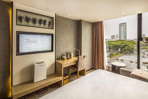 Ένα ή περισσότερα κρεβάτια σε δωμάτιο στο Lavande Hotel Shenzhen Baoan Haiya Binfencheng
