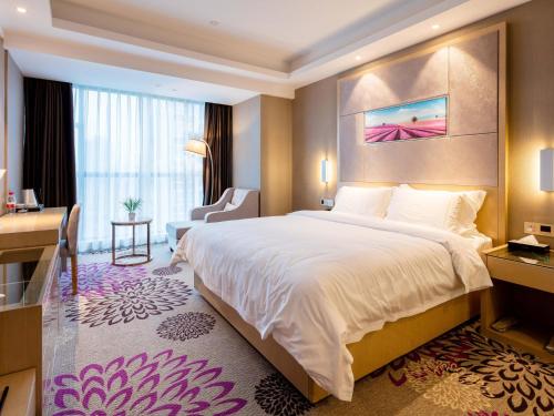 Postel nebo postele na pokoji v ubytování Lavande Hotel (Ganzhou Railway Station Branch)