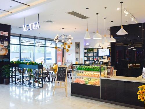 a grocery store with fruits and vegetables on display at Lavande Hotel Xuzhou New Town Midea Plaza in Xuzhou