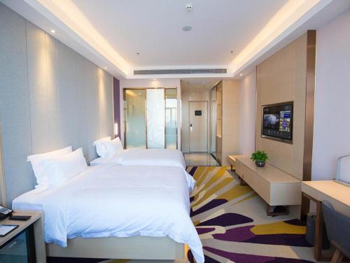 Un ou plusieurs lits dans un hébergement de l'établissement Lavande Hotel (Datong dongxin Plaza Branch)
