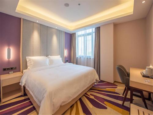 Postel nebo postele na pokoji v ubytování Lavande Hotel Xuzhou People's Square