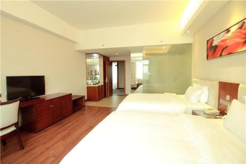 Ένα ή περισσότερα κρεβάτια σε δωμάτιο στο Lavande Hotel Dongguan Tangxia Branch
