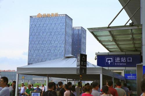 a crowd of people standing in front of a building at Lavande Hotel Xuzhou West Exit of High Speed Rail Station Branch in Xuzhou