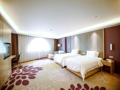Katil atau katil-katil dalam bilik di Lavande Hotel (Gaozhou Xiantai Bridge Branch)